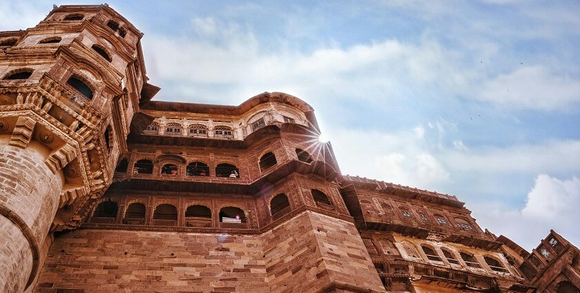 A low-angle view of the iconic tourist attraction of Rajasthan adorned with red shades.