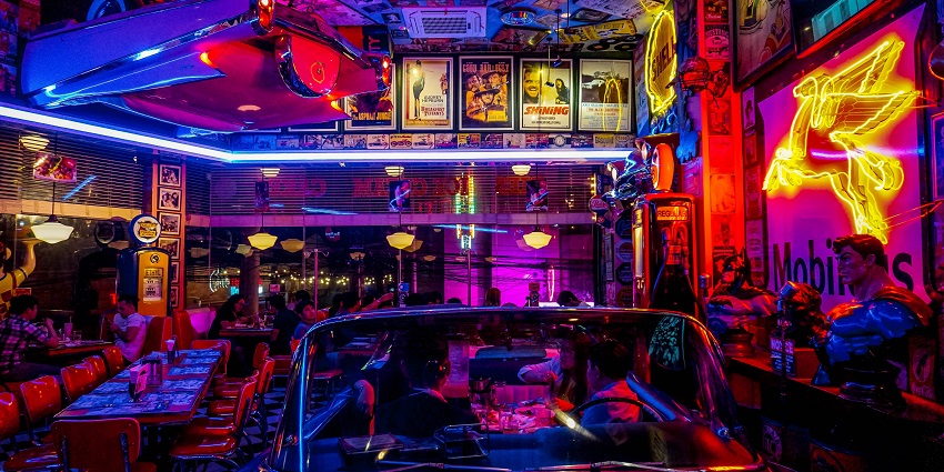 Vibrant view inside a club lit by exotic neon lights offering a unique experience