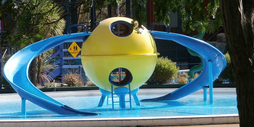A lively image of Fun City Water Park in Alwar with its expansive wave pool and various slides, showcasing why it’s one of the best water parks in Alwar