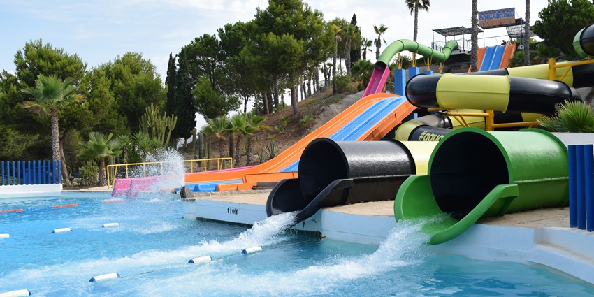 A glimpse of the famous Fun N Food Village featuring a serene pool and other rides.