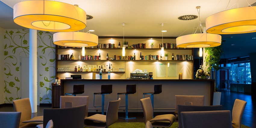 An image of the modern and energetic Fusion Lounge with a DJ and colourful lights.