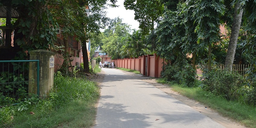 A prestigious Vedic institution in Tirumala, surrounded by lush greenery and ancient manuscripts.