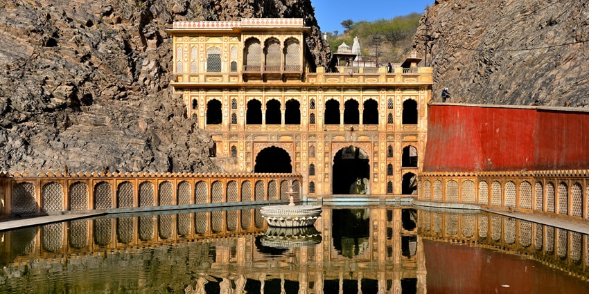 The image shows the GaltaJi temple complex, a must-visit on your Jaipur tourist places list