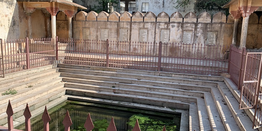 View of Galtaji Temple complex in Jaipur, with its ancient structures and natural surroundings.