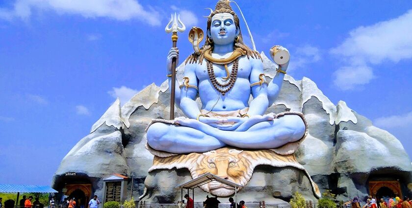 The magnificent Shiva statue towering over everyone at Galteshwar Temple.