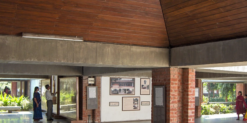 Visitors studying the artefacts related to Mahatma Gandhi at Gandhi Ashram Museum.