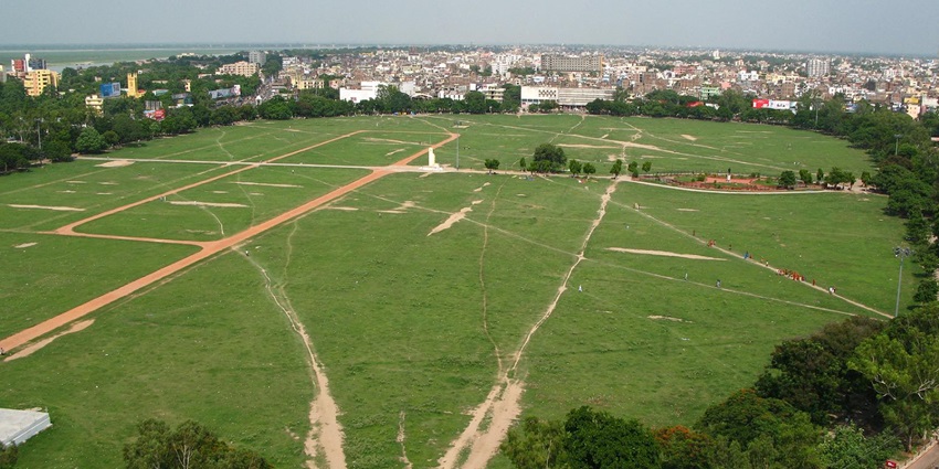 Vast area of Gandhi Maidan surrounded by trees and the Bihar Assembly dome in view