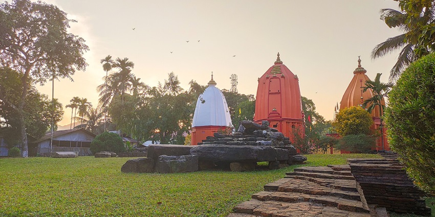 A tranquil park showcasing a cluster of temples, including the Ganesh temple