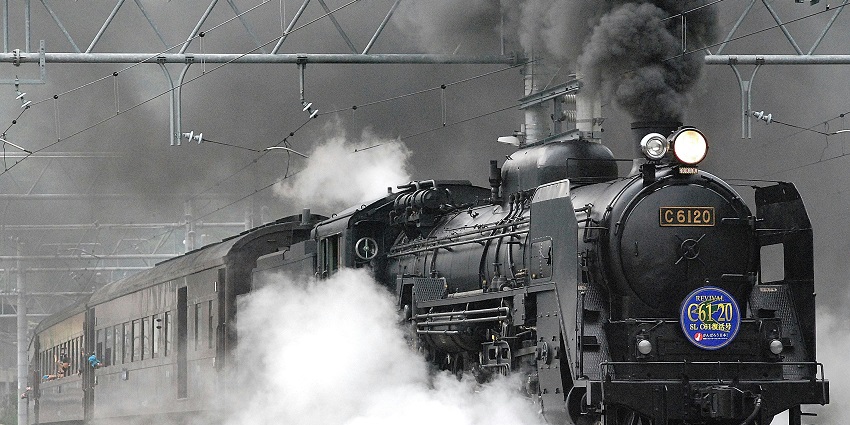 A steam locomotive passing through Sri Ganganagar, highlighting historical railway significance.