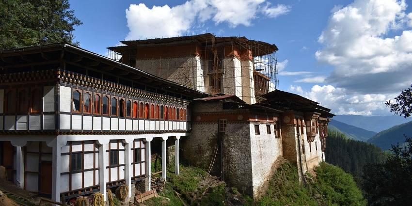 Gantey Monastery, a famous Monastery, surrounded by lush greenery and mountainous terrain.