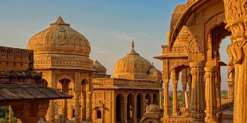 Sunset casts a golden glow over temples, similar to beauty of Garadia Mahadev Temple