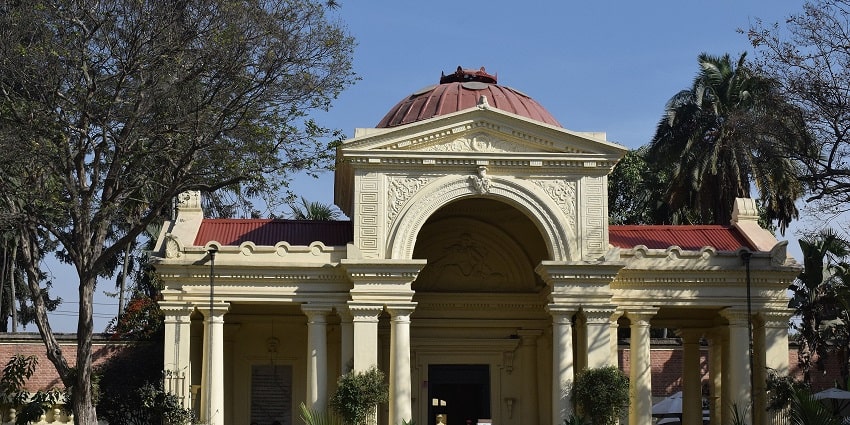 A serene garden in Nepal featuring lush greenery, tranquil water features, and vibrant flowers.