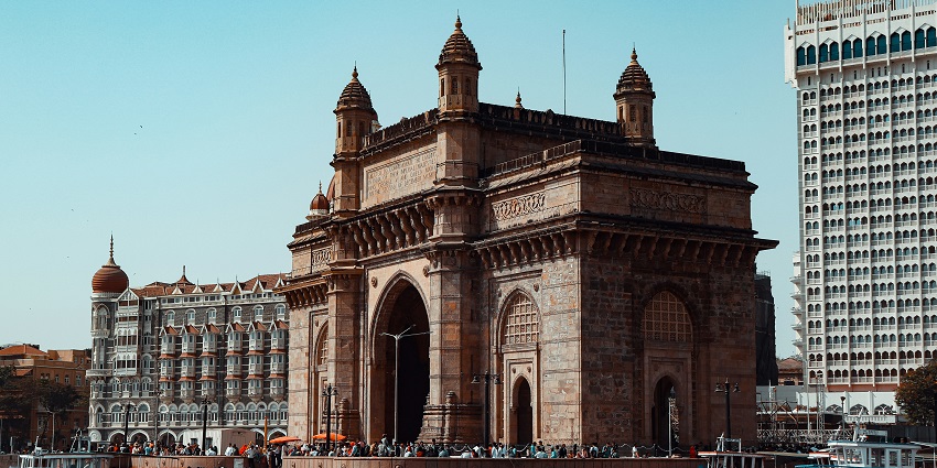 Places to visit in Colaba feature Gateway of India, iconic archway by the Arabian Sea.