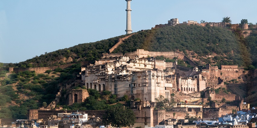 An aerial photograph of a hilltop fort with a large palace compound, among the famous places near Ajmer.