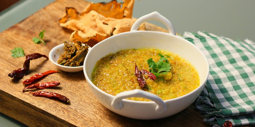 An image of Gatte Ki Khichdi: rice, gram flour dumplings, and spices, ideal lunch.
