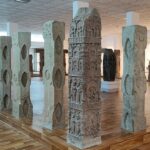 Ancient stone railing fragments from Mahabodhi Temple are displayed at Bodh Gaya Museum.