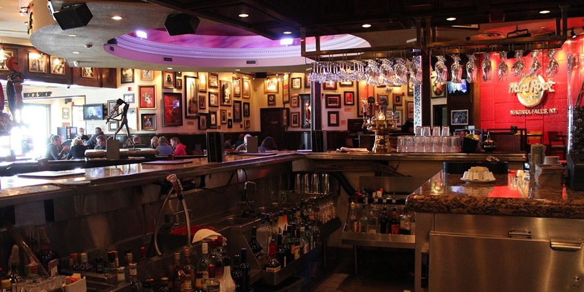 A picture of a bar counter at a pub in Jodhpur with glasses and drinks places across