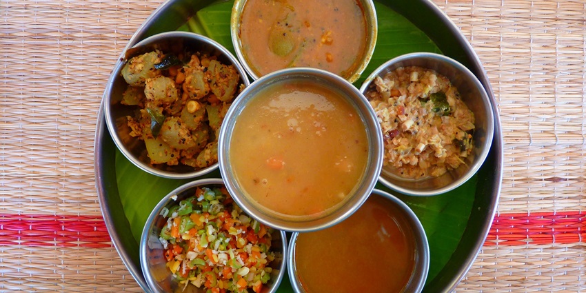 A mouthwatering view of a plate served with cooked dishes to enjoy in Nepal nightlife.