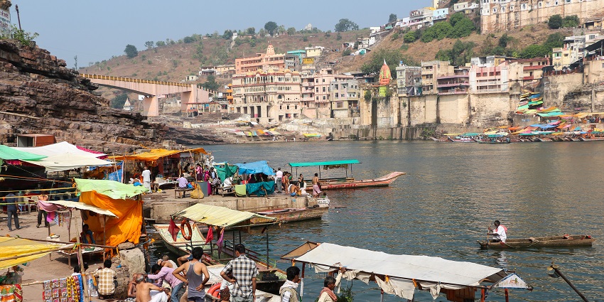 View of the Ghat of Omkareshwar with the devotees that offer serene and scared opportunities