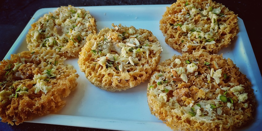An image of Ghevar is one of the best foods in Bikaner, a disc-shaped Rajasthani sweet.