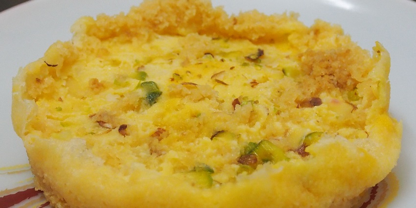 A famous sweet dish - Ghevar, Rajasthani sweet with a crunchy exterior and sweet interior.