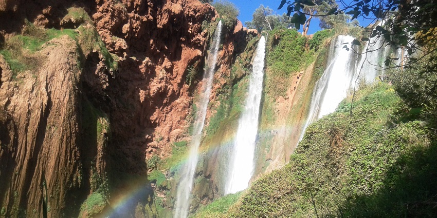 An image of a cascading waterfall over rocky terrain resembling Girmal Waterfall