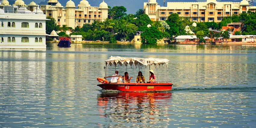 Enjoy a tranquil boat ride on Lake Pichola, a must-see attraction offering breathtaking views in Udaipur.
