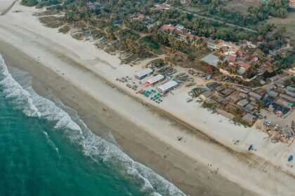 A bird’s eye view of shimmering waters meeting the pristine beaches of the region.