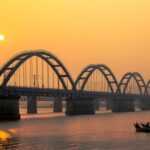 A stunning sunset casts vibrant colours over the Godavari Bridge - things to do in Rajahmundry.