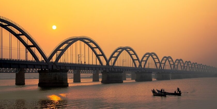 A stunning sunset casts vibrant colours over the Godavari Bridge - things to do in Rajahmundry.