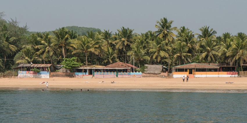 Panoramic view of the Arabian Sea, traditional fishing boat, and the nearest beach to Mysore.