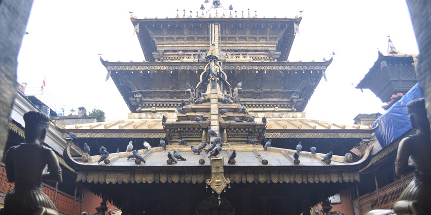 Golden Temple (Hiranya Varna Mahavihar) near Patan Museum, featuring elaborate design.