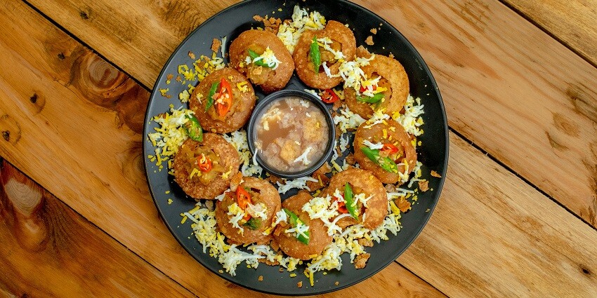 A delicious plate of Pani Puri that is a must-try in street food in Chandigarh.