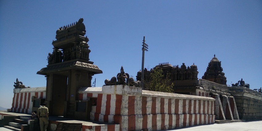 Himavad Gopalaswamy Temple in Karnataka, situated on a misty hilltop with lush greenery.