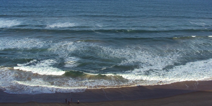 A scenic seaside picture taken at a beach in Odisha, with tranquil views of the blue waters