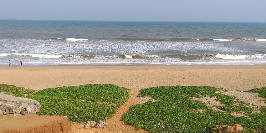 A serene beach at Gopalpur-on-Sea, featuring a sand dune