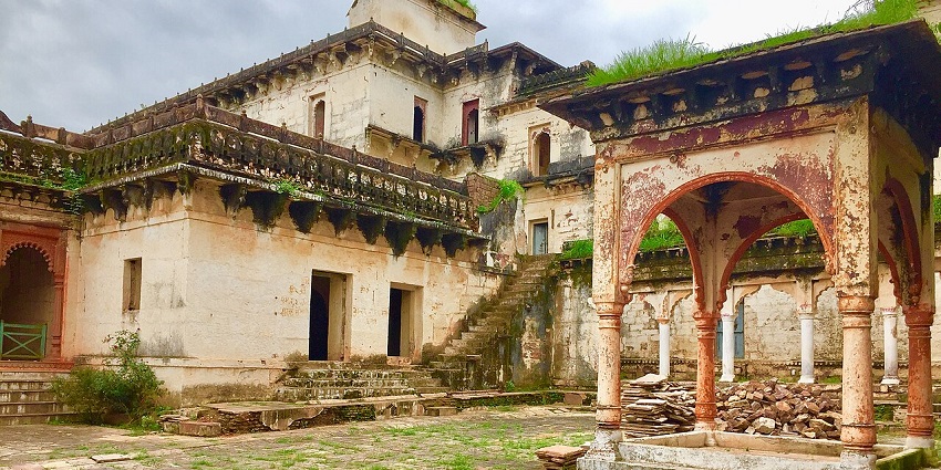 A glimpse of the historic Govindgarh Palace with ornate architecture and gardens.