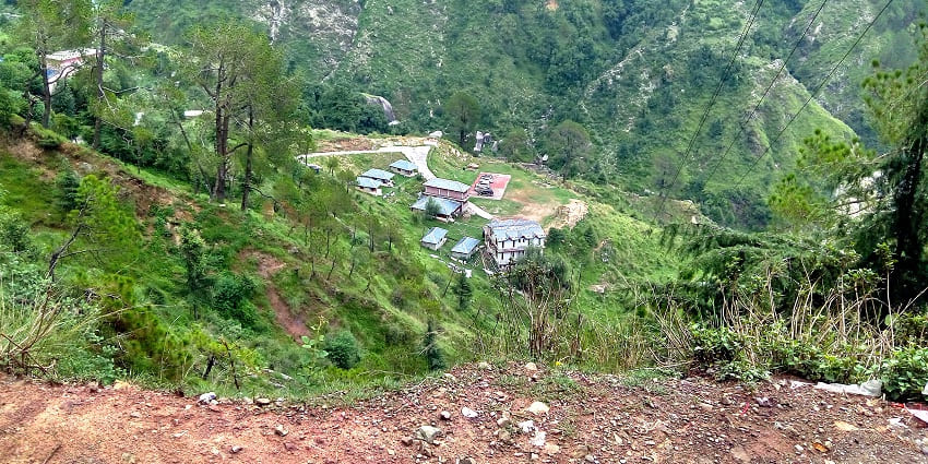 Great Himalayan Resort with traditional architecture, nestled amidst lush greenery and mountain views