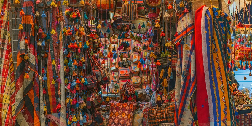 A glimpse of colourful clothes and dresses piled up at the Greater Kailash market.