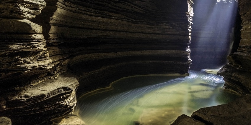 A lake inside the enormous Gupteshwar Cave, offering surreal experiences to visitors.