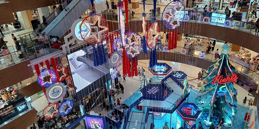 Stylish interior of Gurney Plaza shopping mall in Penang, showcasing various retail outlets.