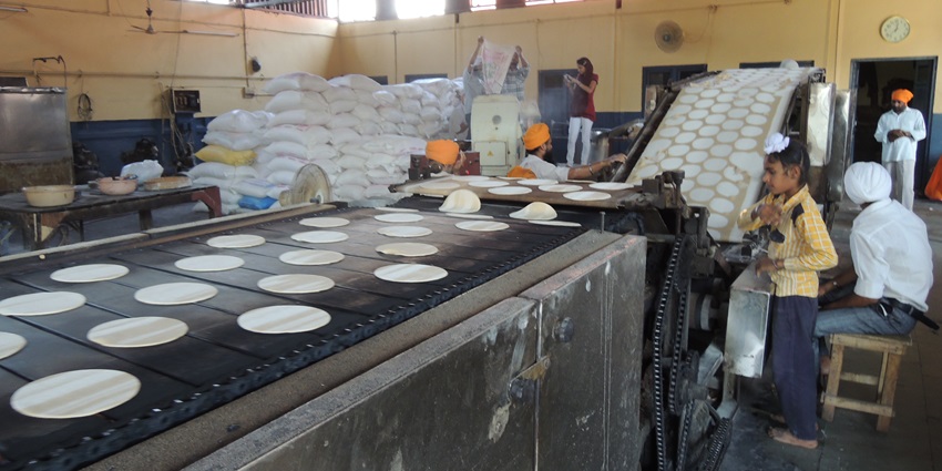 A unique dining experience awaits at the langar or community kitchen at Guru Ka Langar, near the Golden Temple.