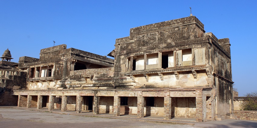 A panoramic view of Gwalior Fort, famous place near Gwalior Zoo with its massive stone walls and intricate architectural details.