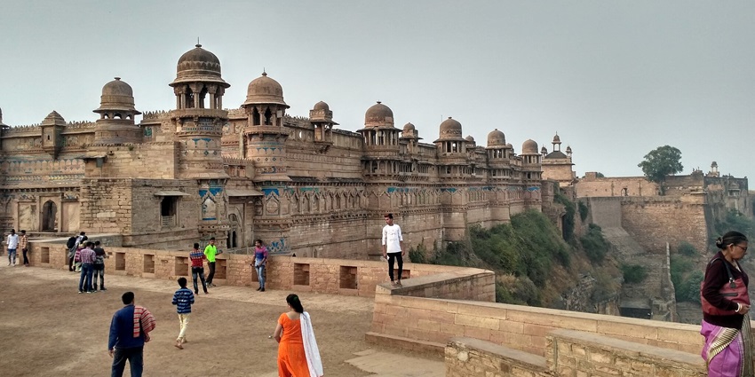 A panoramic view of Gwalior Fort in Madhya Pradesh, perched on a rocky hilltop.