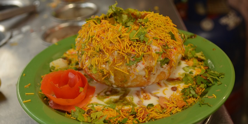 A vibrant plate of Raj Kachori, a popular Indian street food - best food in Chandni Chowk