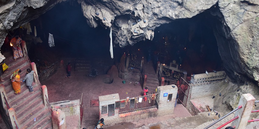A natural cave in Nepal housing the Haleshi Mahadev Temple with a staircase leading down