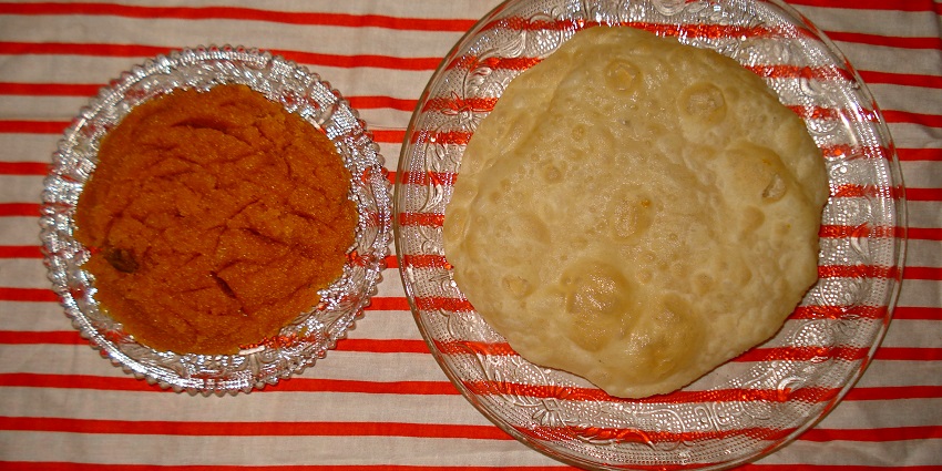 An image of Halwa Puri which is one of the famous dishes to try on your next vacation.