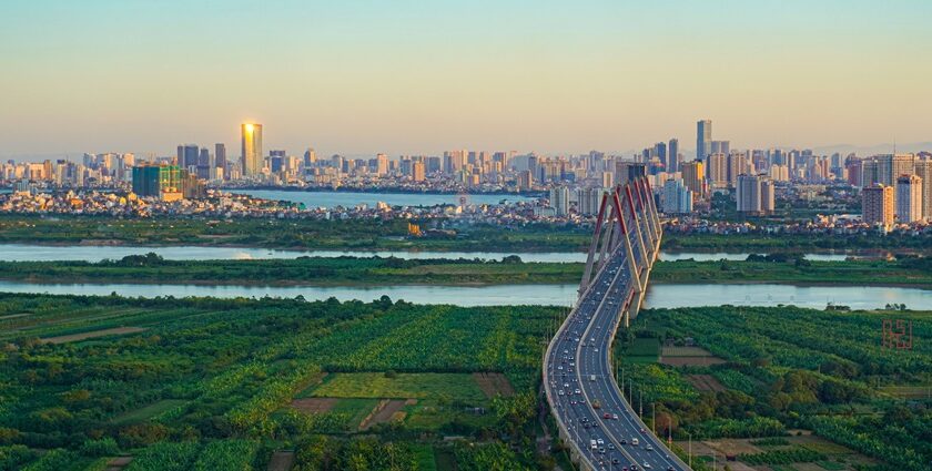 Dusk over Hanoi's skyline, with city lights aglow. A highlight among places to visit in Hanoi.