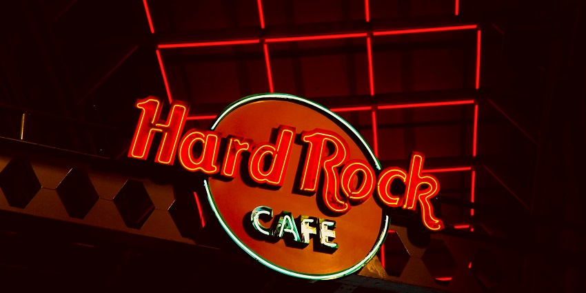 Hard Rock cafe sign with red lights and dark background, with live music enjoy nightlife in Delhi