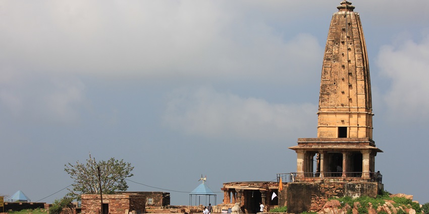 A view of the towering Harshnath Temple featuring intricate stone carvings in Rajasthan.